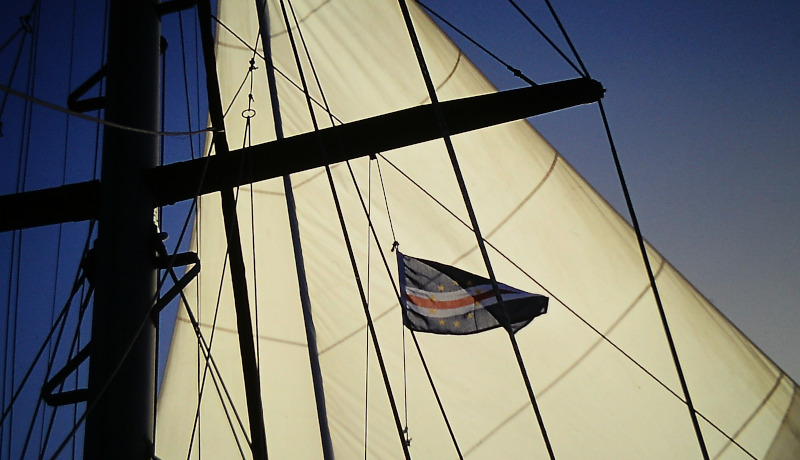 Atlantic sailing: Under the starboard - Saling flutters the guest country flag of the Cape Verde Islands