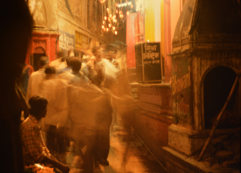 India: Young men romp barefoot through the Alleys at Mahashivarati evening in Varanasi