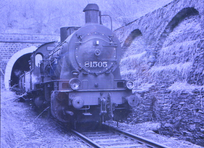 Old railway tunnel Huldange - Goedange in Luxemburg with steam locomotive 