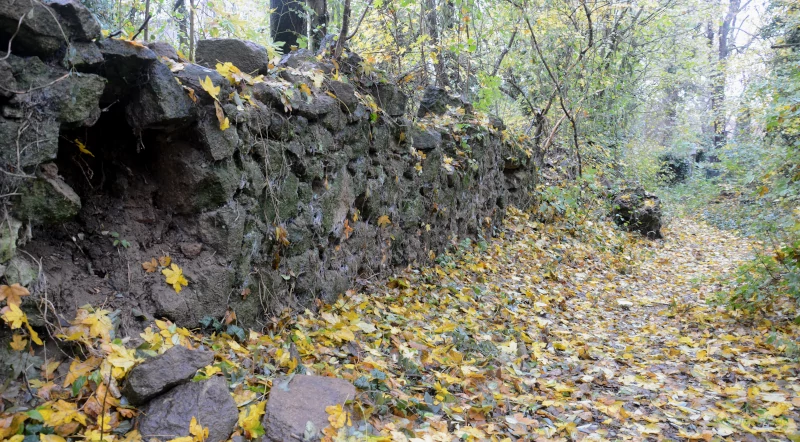 Old quarry stone wall at cemetery Beucha