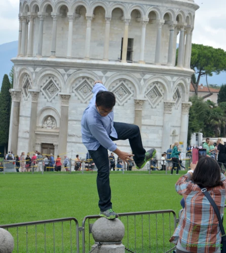Artistic contortions on the Leaning Tower in Piazza dei Miracoli