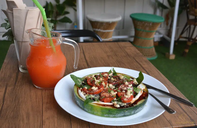 Sliced Melon with tomato and soy cheese in the Vegan startup "All you eat is love" in Chiang Mai
