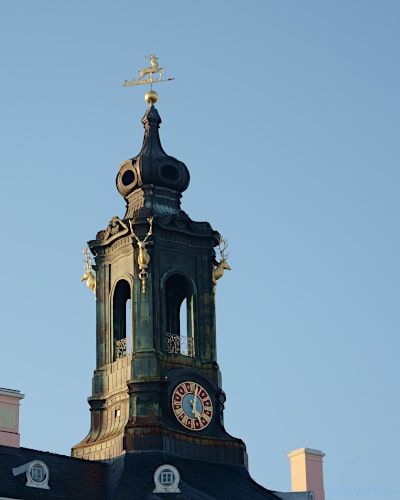 Baroque ridge turret with clock and weather vane "Jumping Stag"