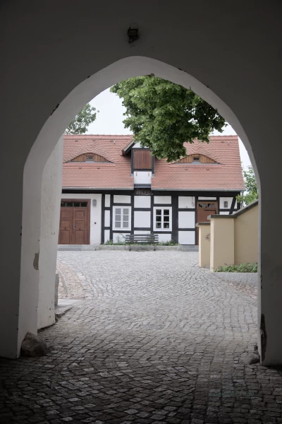 View into the castle yard of Dueben Castle through the gate in the Donjon
