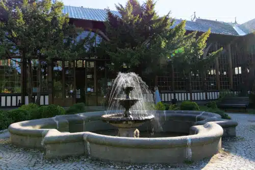 A fountain in front of the Spa house