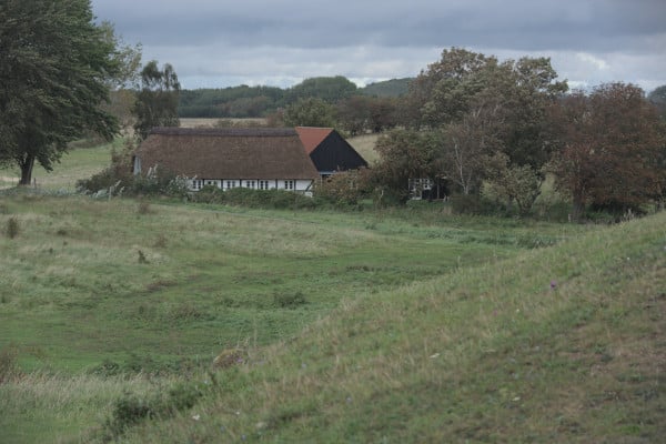 Lonely farm with thatched roof half-timbered houses at Langeland island