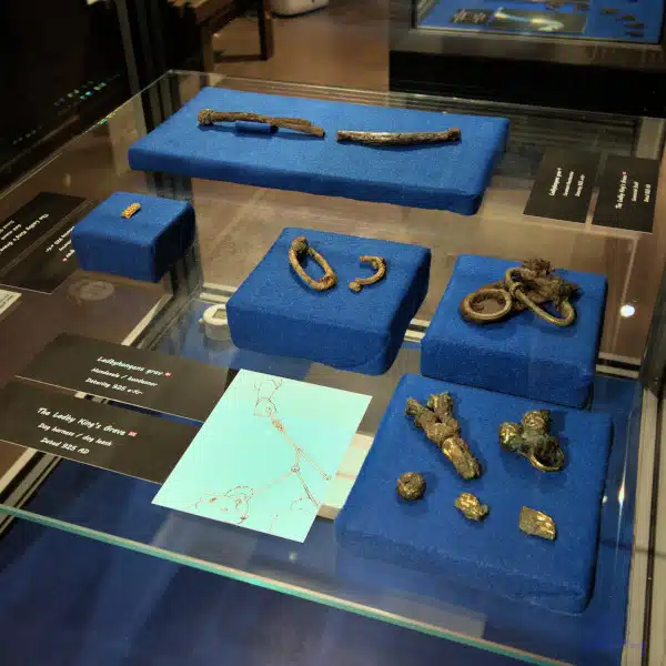 Viking age Metall fittings of a dog harness in a showcase of Ladby Museum exhibition